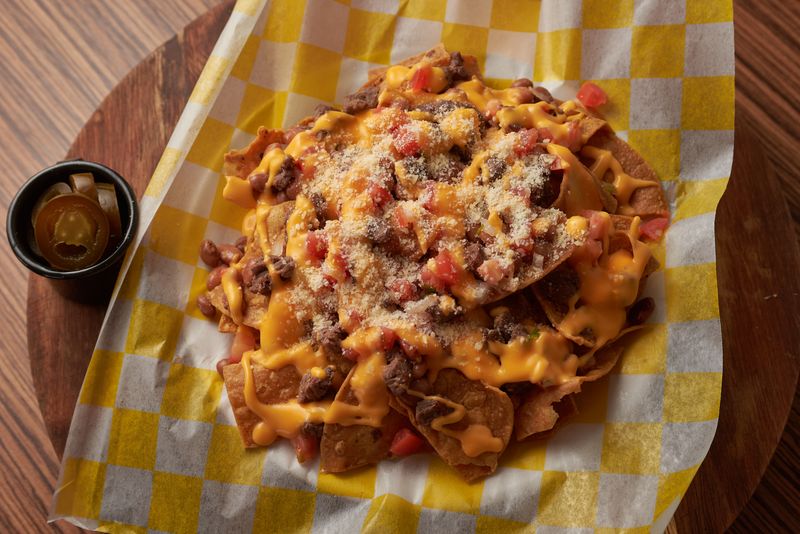GYG Loaded Nachos with cheese sauce and jalapeños